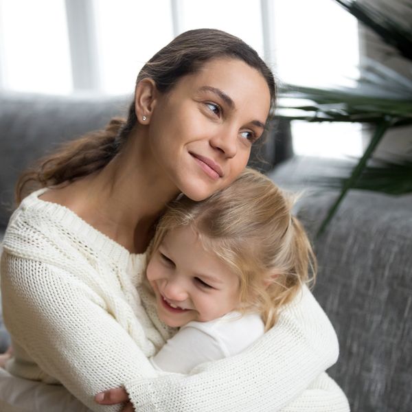 Mother and daughter hugging
