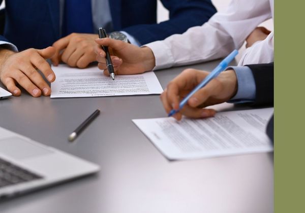 lawyer helping people sign contract