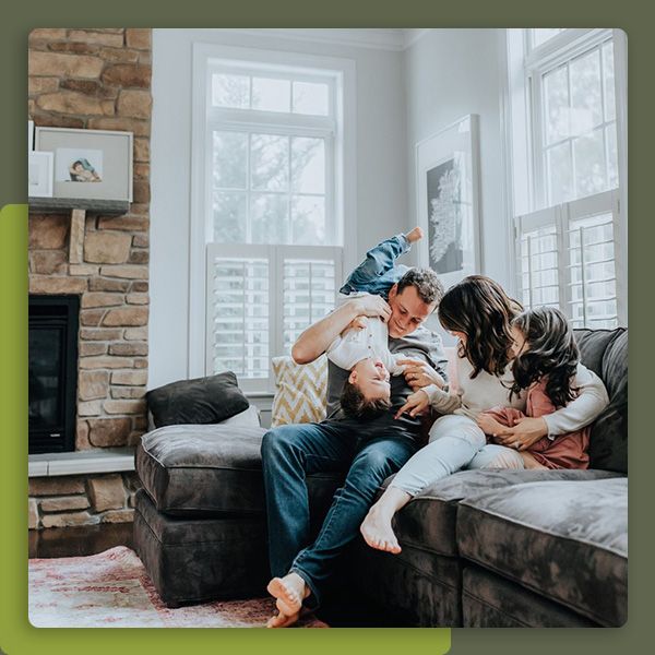 Family hanging out on a couch