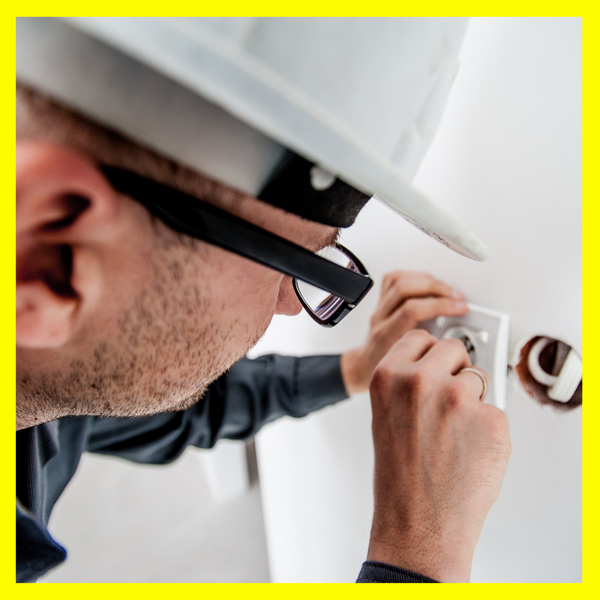 Electrician fixing a socket