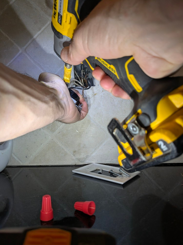 Electrician installing new outlet Greensboro NC