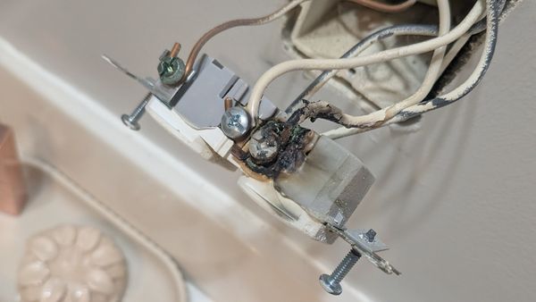 Burnt Outlet Caused By Electrical Arcing