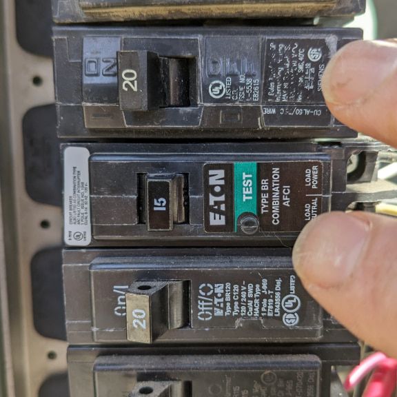 AFCI circuit breaker tripped inside an electrical panel