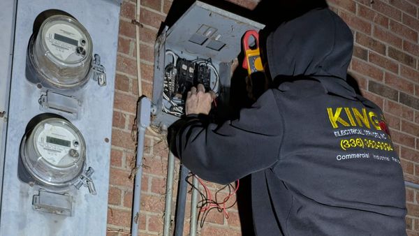 Emergency Electrician Troubleshooting Power Outage at Nighttime