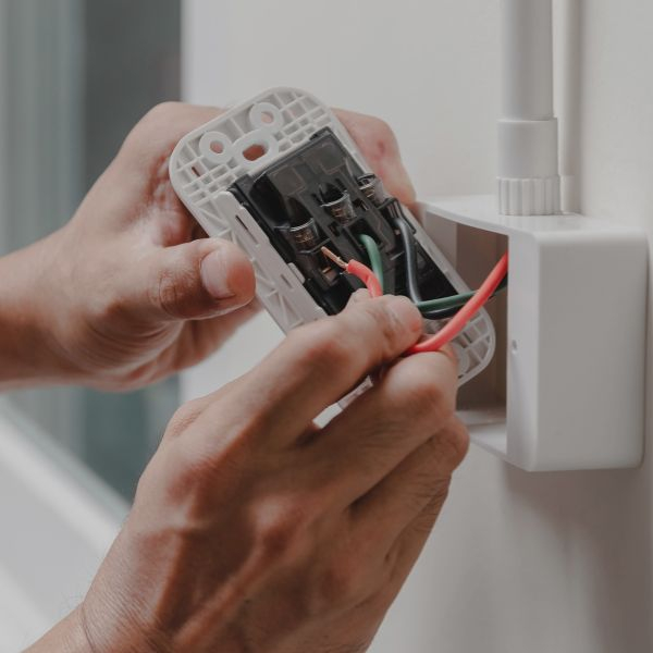 Electrician working on an outlet