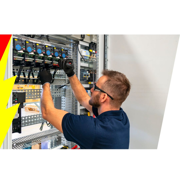 Electrician working on an industrial electrical panel