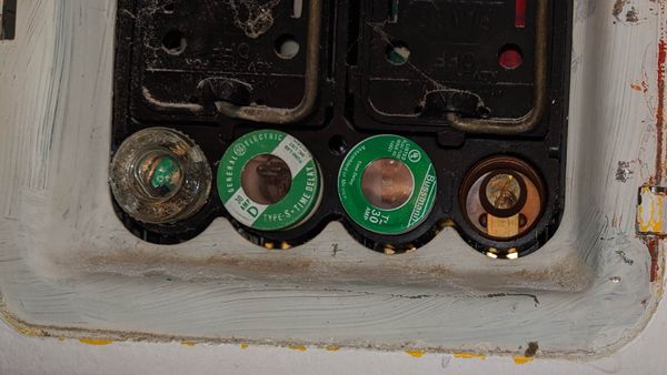 Overfused residential fuse box with incorrect 30-amp fuse installation