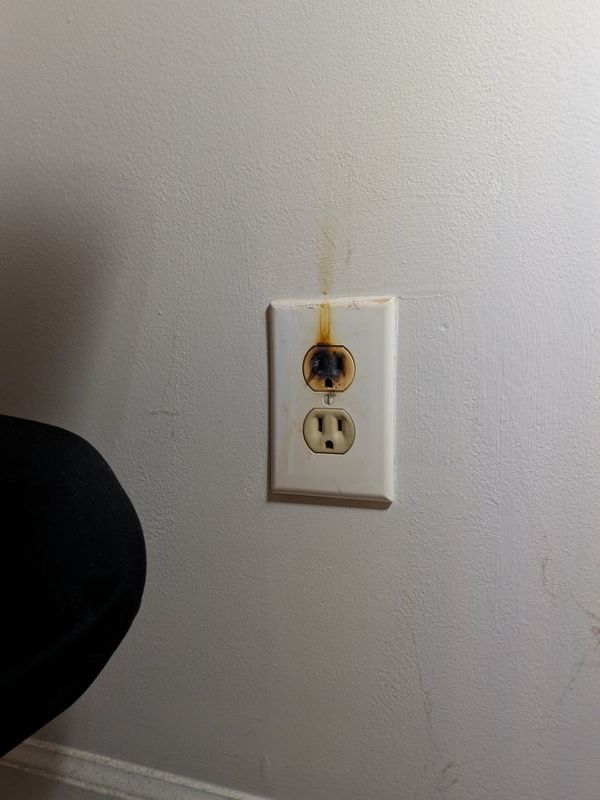 Burnt receptacle face on wall Greensboro, NC