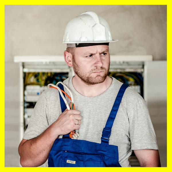 An electrician holding cables