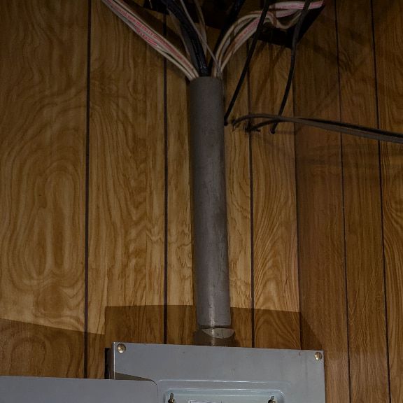 Improper NM Cable Bundling Above Electrical Panel