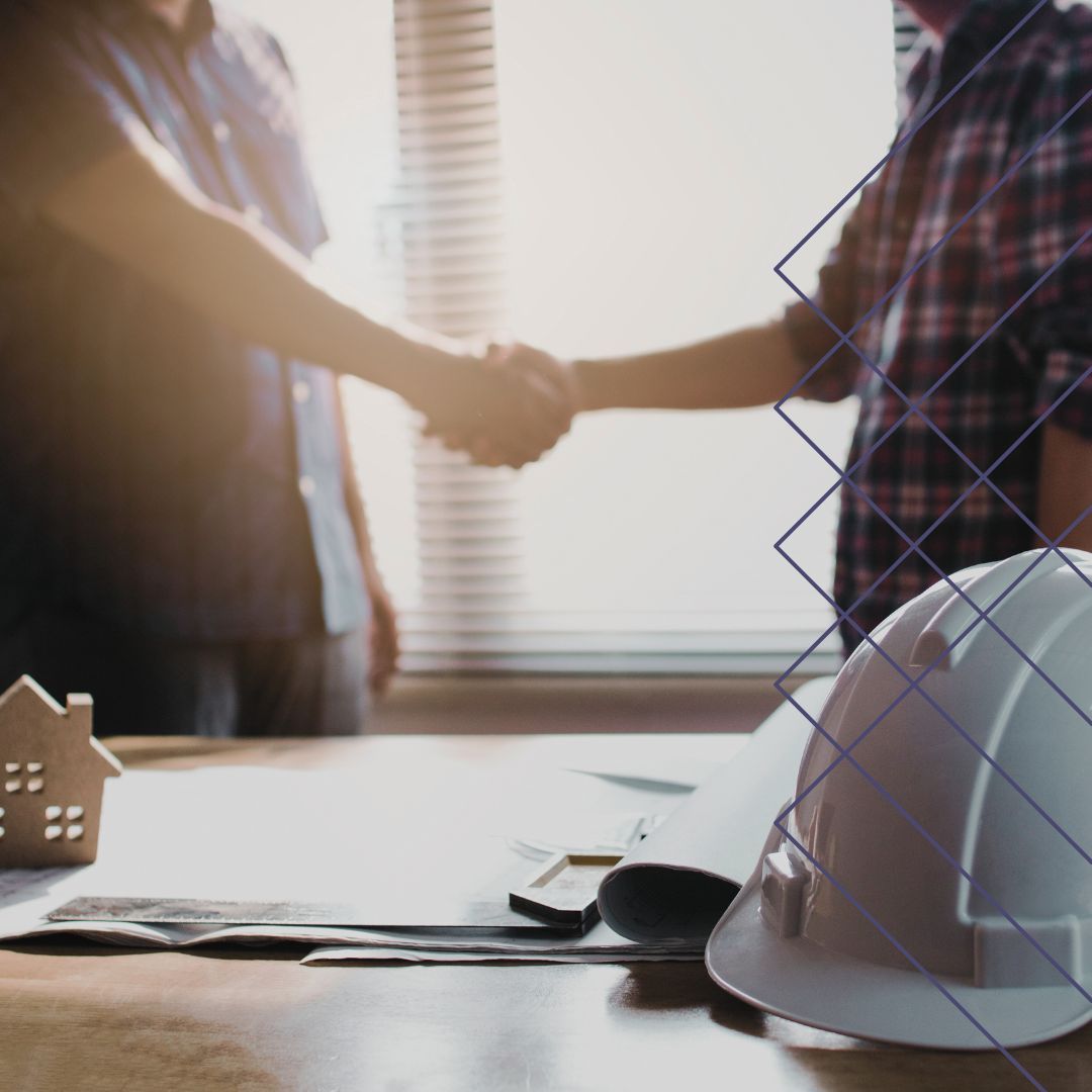 construction worker shaking hands with client