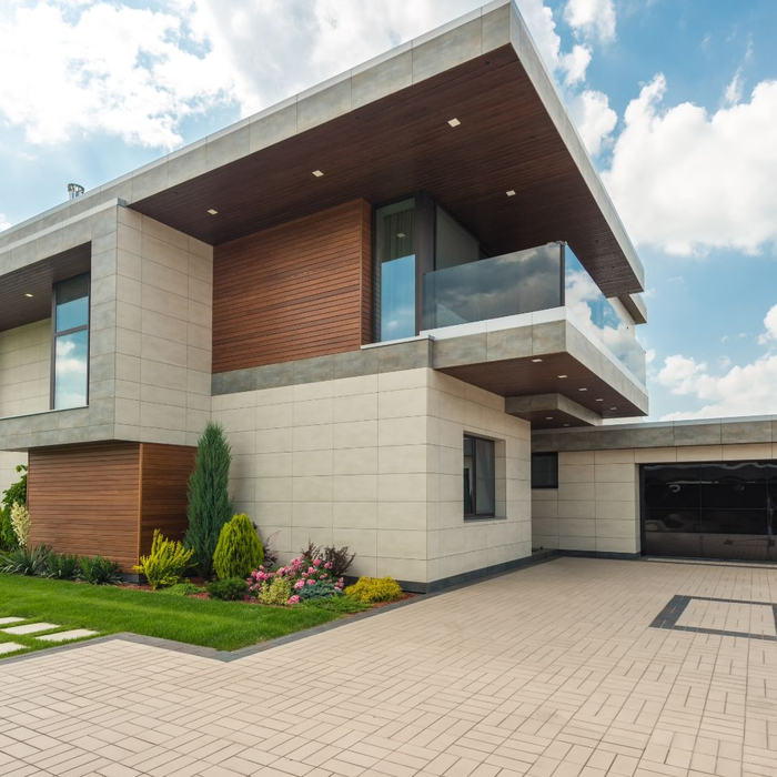 house with coated concrete driveway