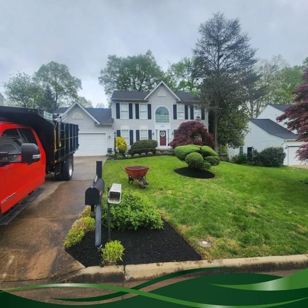 Work truck finishing residential landscaping project Work truck finishing residential landscaping project
