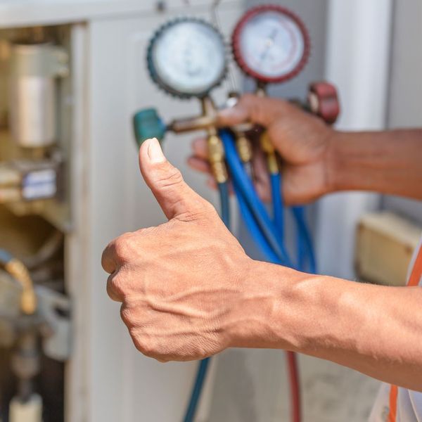 HVAC technician doing maintenance on a unit How to Choose the Right HVAC System for Your Home4.jpg