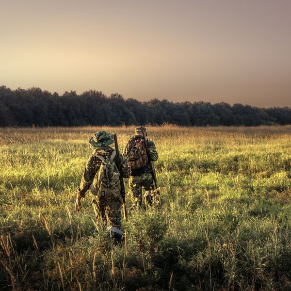 Two people hunting in a field in Alabama