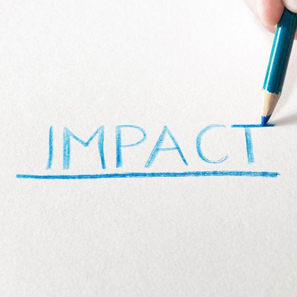 The word "Impact" written in blue pencil