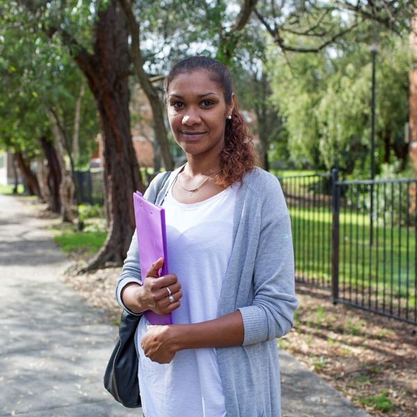 woman with folder of paperwork 