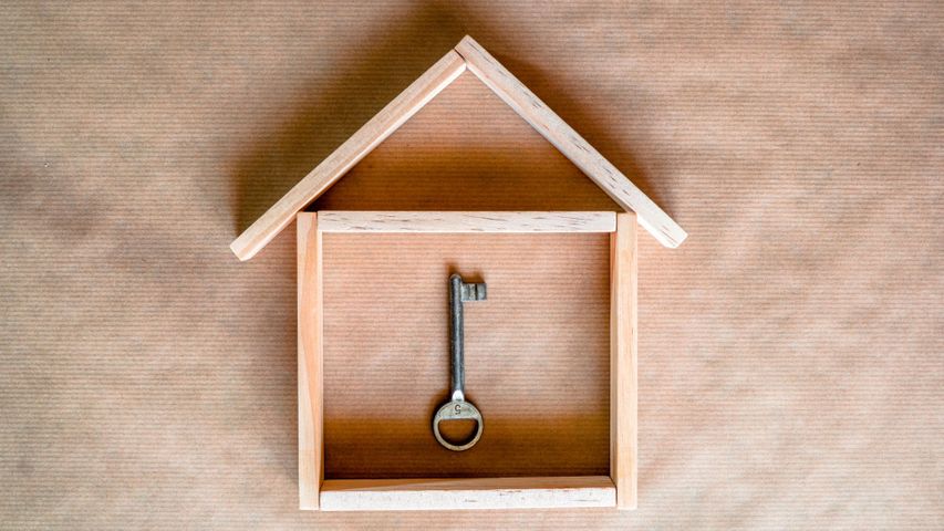 wooden house with a key in the center