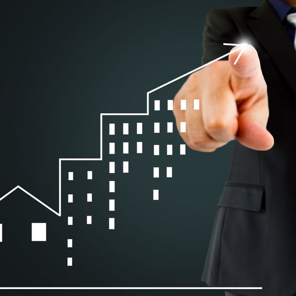 Graphic of someone drawing a housing graph Graphic of someone drawing a housing graph