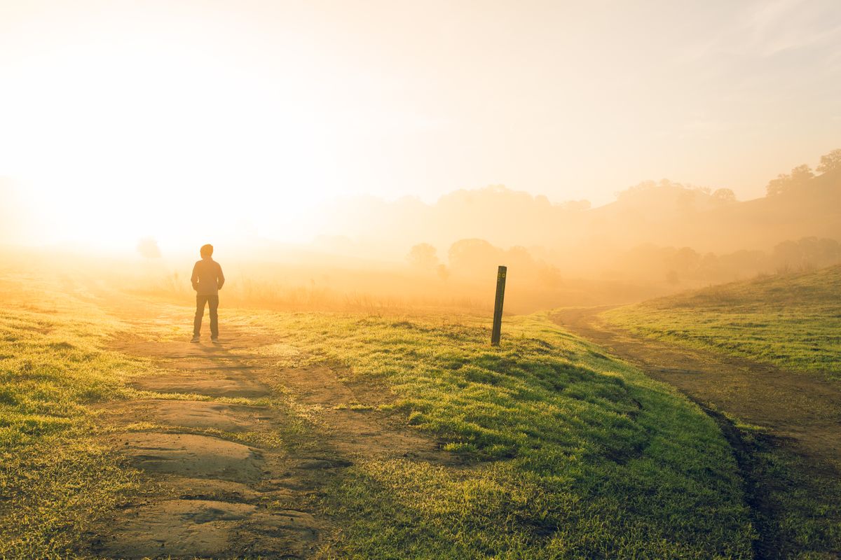 person on an open path at sunset.jpg