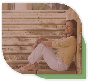 woman sitting outside on cement steps