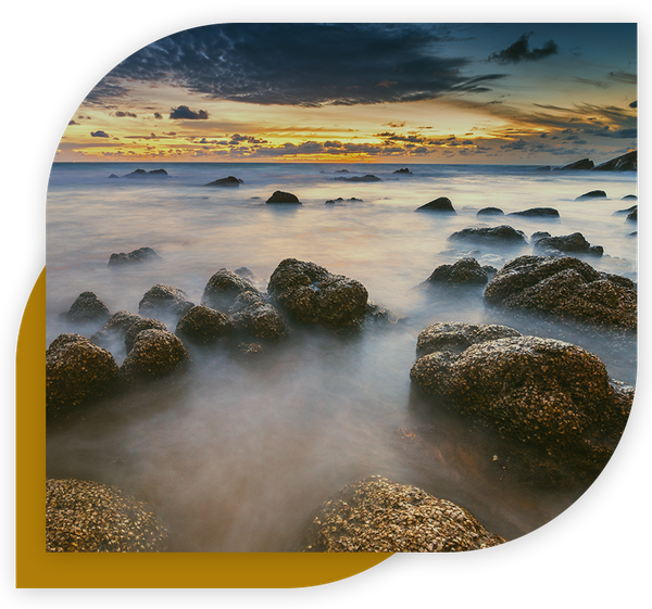 photo of calm water flowing over rocks