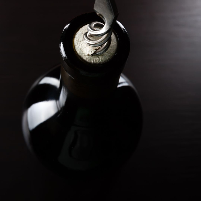wine bottle and corkscrew