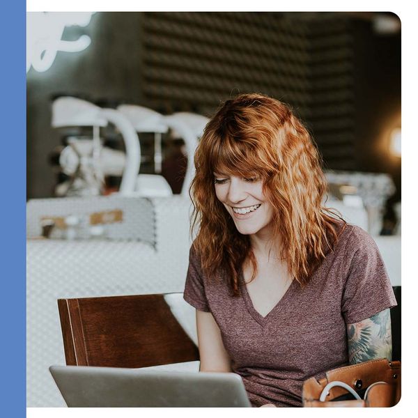 smiling woman at laptop