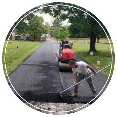 Rolling asphalt over cemetery road for smoothness