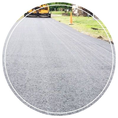 Road being resurfaced with chip seal process