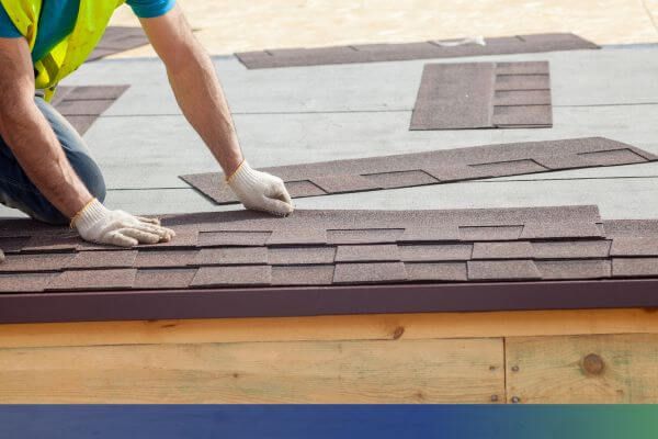 roofer installing shingles