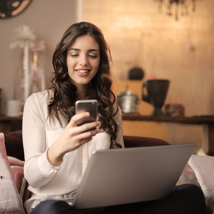 woman looking at her phone