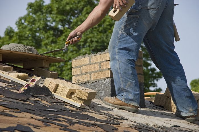 man building chimney