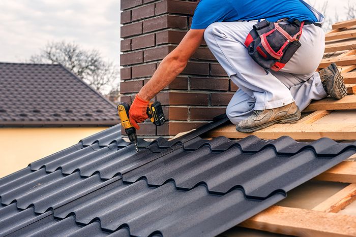 man drilling chimney