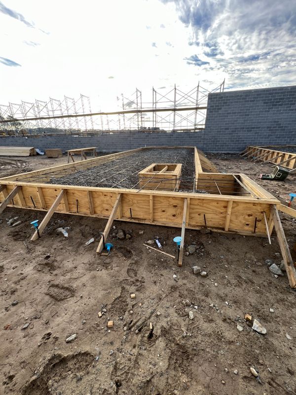 Concrete Pad Formwork with Rebar on Construction Site