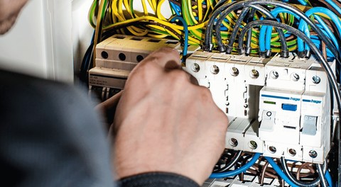 A clean, minimalist image showing new electrical conduit or wires being neatly installed in a wall during a home renovation, implying new construction or additions. The scene should be well-organized and professional. A clean, minimalist image showing new electrical conduit or wires being neatly installed in a wall during a home renovation, implying new construction or additions. The scene should be well-organized and professional.