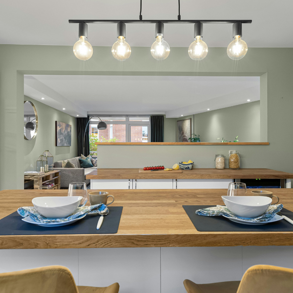 Modern Kitchen Island with Track Lighting and Pass-Through Window