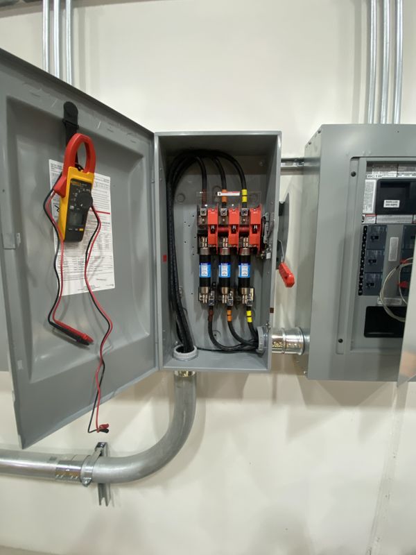 Interior of a Fused 480V, 3-Phase Disconnect Switch with Clamp Meter