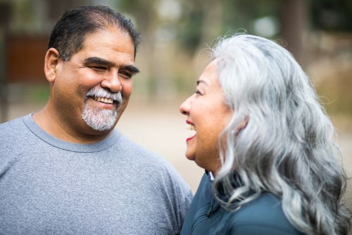 A couple smiling at each other