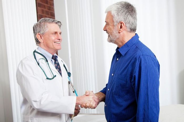 Doctor and patient shaking hands