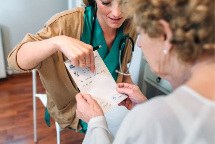 Doctor giving a patient a prescription