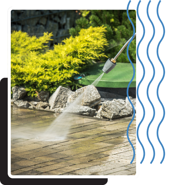 pressure washing nozzle cleaning brick paver walkway