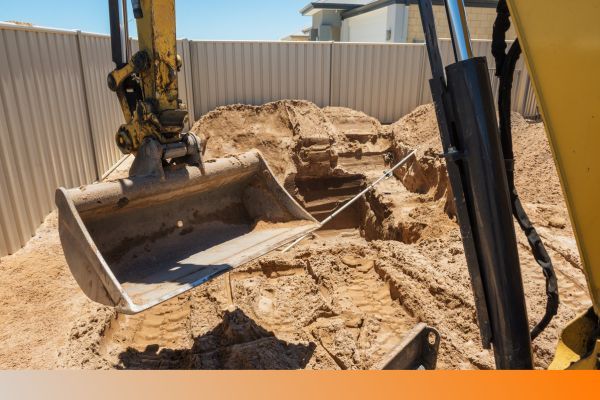 a backyard being excavated Site Prep.jpg