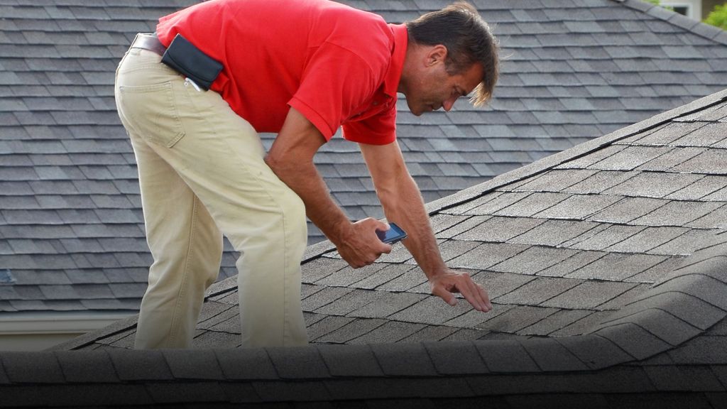 roofer inspecting a roof