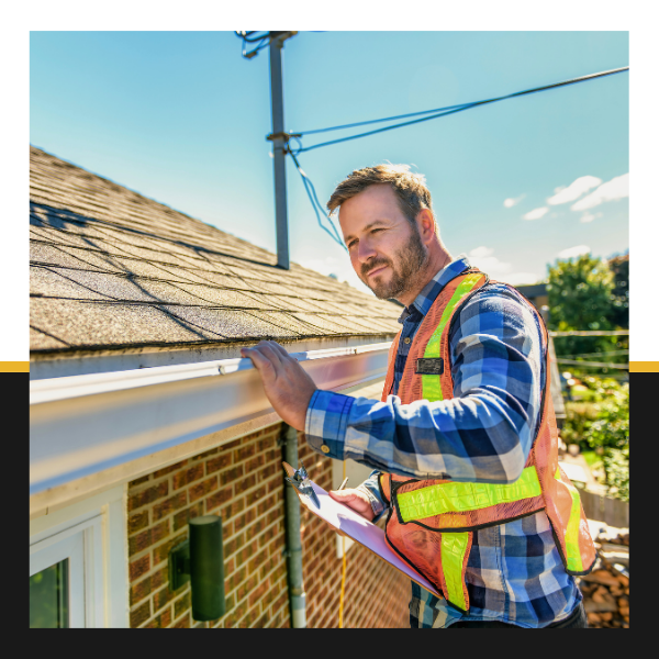 roofing contractor inspecting roof