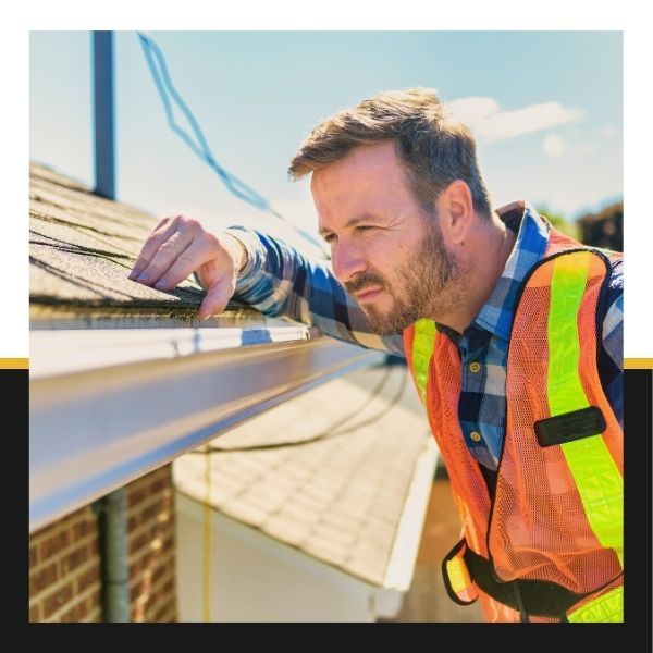 roofer inspecting roof