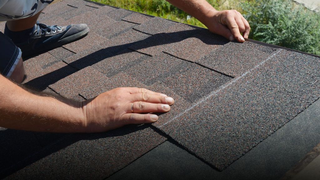 roofer looking at roofing