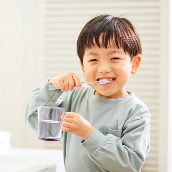 Child brushing his teeth