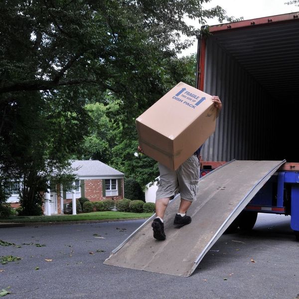 A mover carrying a box 
