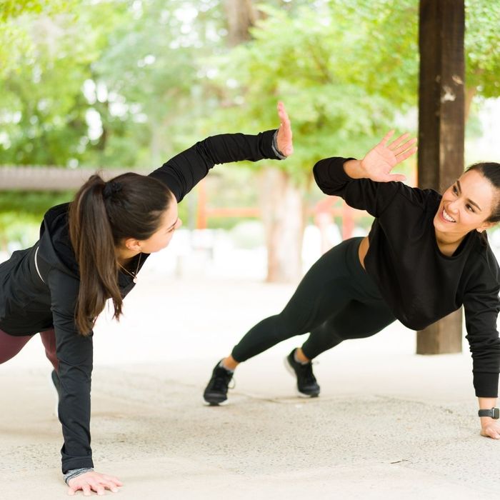 Two women exercising together.